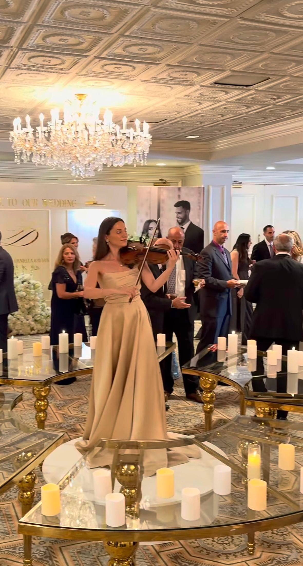 Tatev Muradyan performing for guests in a ballroom